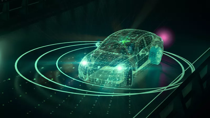 Futurisztikus kinézetű neon zöld önvezető autó, ami LiDAR-t használ a környezete feltérképezésére.